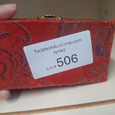 Chinese Baoding balls, also known as Chinese stress balls, meditation balls, or health balls, presented in a red silk box. 