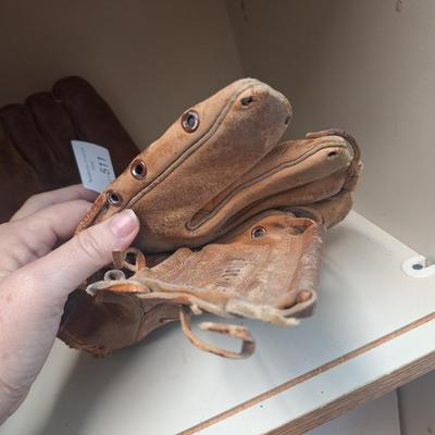 two vintage mitts- heavily used