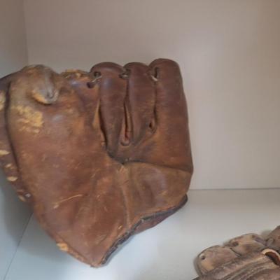 two vintage mitts- heavily used