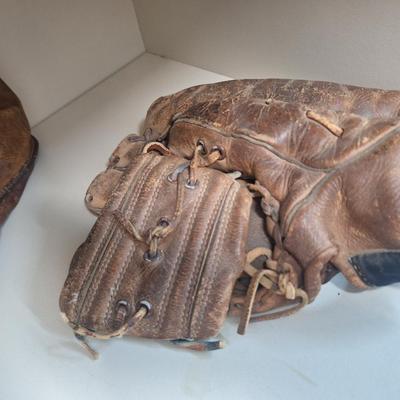 two vintage mitts- heavily used