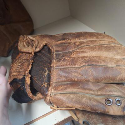 two vintage mitts- heavily used