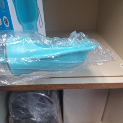 portable pet water bottle, hold it sideways so dog can lap water