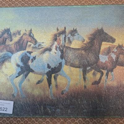 Glass cutting board with wild horses design.