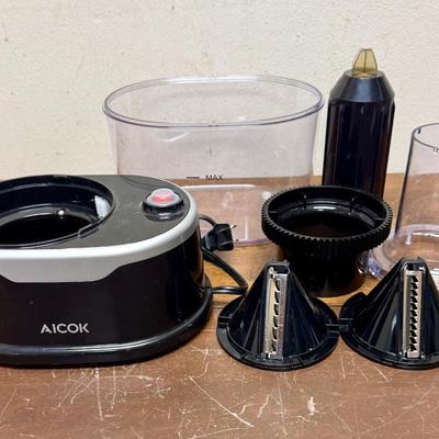 Sale Photo Thumbnail #626: Electric vegetable slicer. Comes with 2 slicing inserts.  Tested, runs smoothly and quietly. Near new condition.