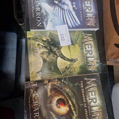 three paperback books from the Merlin Saga by T. A. Barron. 
