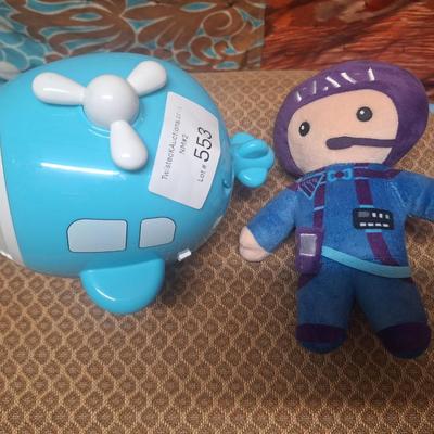stuffed astronaut and a toy bubble maker shaped like a helicopter