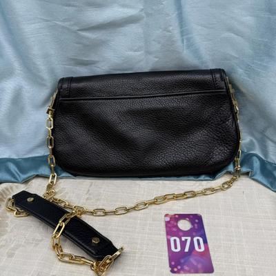 Sale Photo Thumbnail #112: Detachable chain, magnetic closure, clutch or cross body bag, black with gold tone chain.
11 x 6.5 inches 
1 interior and 1 exterior zippered pocket
Like new