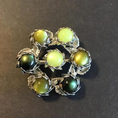 Sale Photo Thumbnail #105: Vintage chartreuse lucite or cabochons set in silver tone leaf-motif metal base 
Please see attached photos