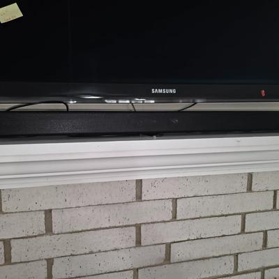Samsung Sound Bar with subwoofer and headphones