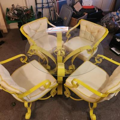 George Mulhauser for Plycraft "Sultana" armchairs with a glass-top table.