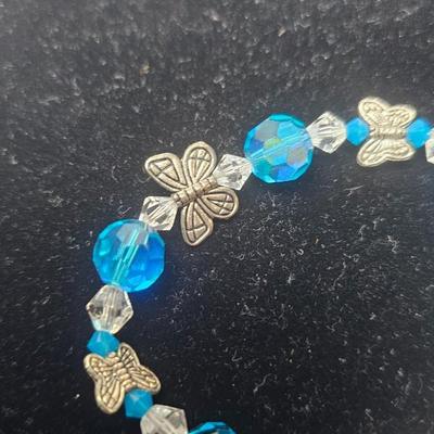 Blue Faceted Crystal Butterfly Charm Bracelet with Gold-Tone Clasp