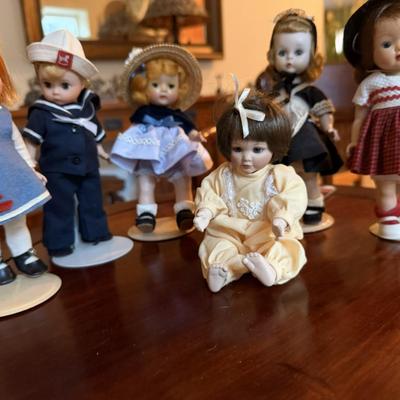 Sale Photo Thumbnail #193: 1- Vogue  Ginny  Wee Imp
2- Madame Alexander Kurt Doll
3- Vogue Ginny Doll
4-Ashton Drake 6 inch (sitting)
5 -Madame Alexander (Little Women)
6-Vogue  Ginny Doll  #53 Candy Dandy Series 
All dols are intact, pretty nice condition