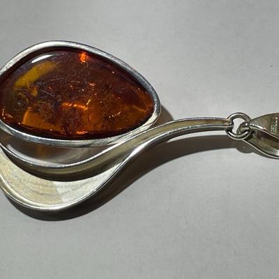 Vintage Poland Baltic Amber Sterling Silver Pendant in VG Preowned Condition as Pictured.