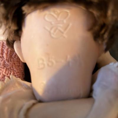 Sale Photo Thumbnail #196: Bisque/porcelain doll made in the Thuringa region of Germany.
Features open and close eyes, composition body, bisque limbs
B 5  - 4 3/4 
good condition