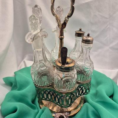 Sale Photo Thumbnail #207: Lovely old caddy for vinegar, oil, salt, pepper, mustard, etc. 
6 containers, 13.5 inches tall
Fair condition