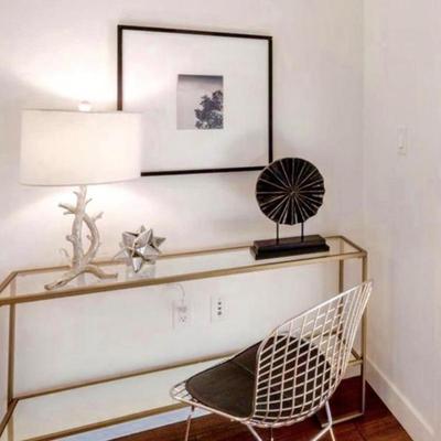 Sale Photo Thumbnail #117: -Gold console table 
-Wire chair 