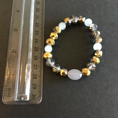 Sale Photo Thumbnail #167: Gold tone faceted beads with opaque beads stretch bracelet Please see attached photos