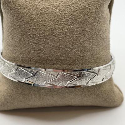 Pewter cuff bracelet and Trifari bracelet
