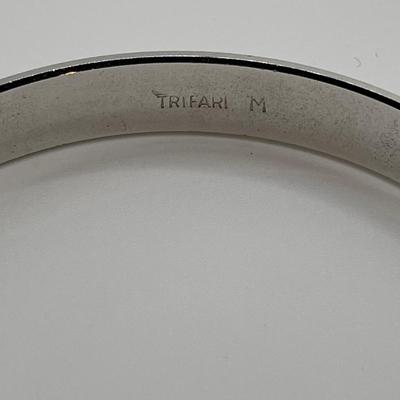 Pewter cuff bracelet and Trifari bracelet