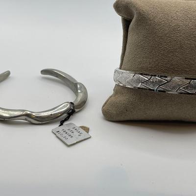 Pewter cuff bracelet and Trifari bracelet