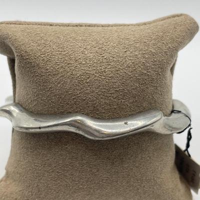 Pewter cuff bracelet and Trifari bracelet