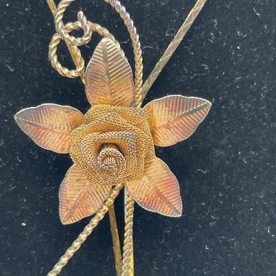 Gerry’s flower pin and slide rose lariat necklace