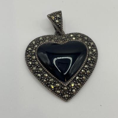 Sterling & marcasite pendant w/ a black onyx heart in center