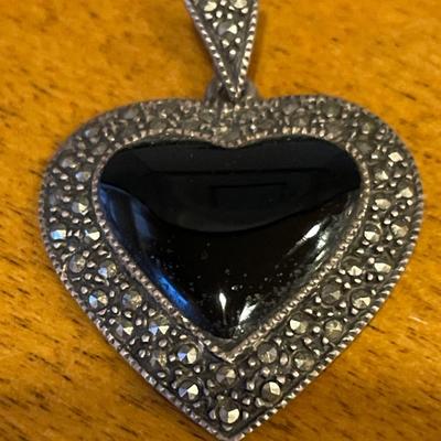Sterling & marcasite pendant w/ a black onyx heart in center