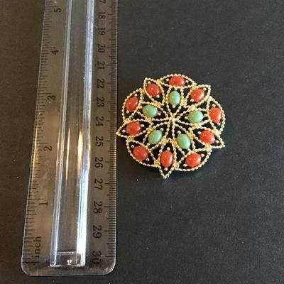 Sale Photo Thumbnail #64: Beautiful Vintage Sarah Coventry Acapulco brooch with gold tone setting with faux green Jade and red coral cabochon stones Please see attached photos