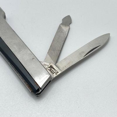 LOT 34: Vintage Collection - 1999 State Quarters, Framed John Sloan 8 Cent Stamp, Vernco Folding Letter Opener / Knife, 1 Cent Stamps,...