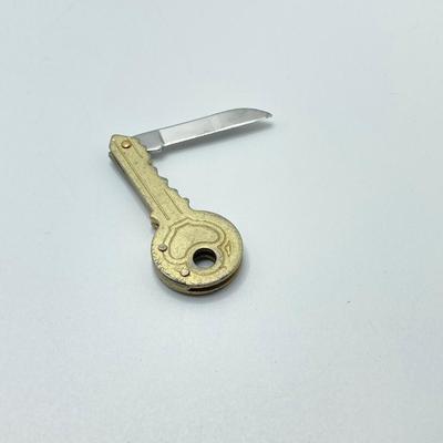 LOT 34: Vintage Collection - 1999 State Quarters, Framed John Sloan 8 Cent Stamp, Vernco Folding Letter Opener / Knife, 1 Cent Stamps,...