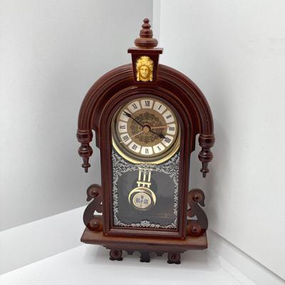 LOT 45: Pair of Miniature Wall Clocks (M.I. Hummel Stormy ARS Sacra 9743 / Plastic Battery Operated with Four Pine Cone Weights