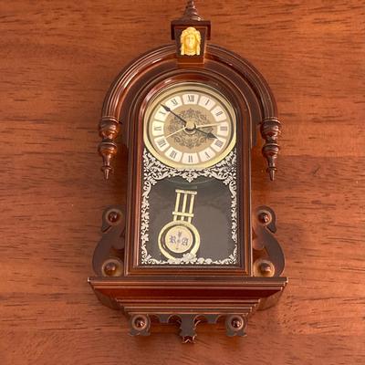 LOT 45: Pair of Miniature Wall Clocks (M.I. Hummel Stormy ARS Sacra 9743 / Plastic Battery Operated with Four Pine Cone Weights