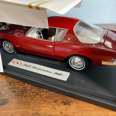 LOT 53: Diecast Collectible Cars in Original Boxes - Excellence 1965 Alfa Romero Giulia Sprint GTA and Sun Star 1963 Studebaker Avanti