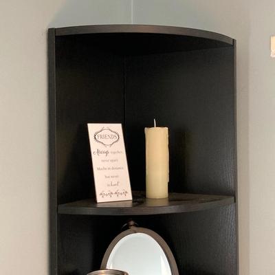 LOT 63: Black Corner Shelf Unit with Home Decor - Mirror, Candle Holder, Pink Glass Bowl, Sir Arthur Conan Doyle Book and More