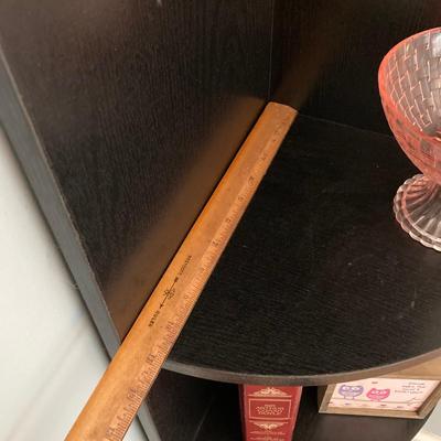 LOT 63: Black Corner Shelf Unit with Home Decor - Mirror, Candle Holder, Pink Glass Bowl, Sir Arthur Conan Doyle Book and More