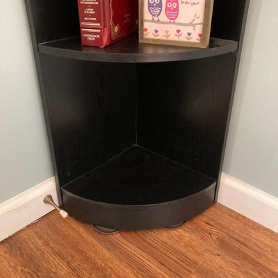 LOT 63: Black Corner Shelf Unit with Home Decor - Mirror, Candle Holder, Pink Glass Bowl, Sir Arthur Conan Doyle Book and More