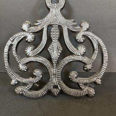 LOT 94: Vintage Family Tree Cast Iron Trivets, Vintage Black Cast Iron Footed T-15 Butterfly Trivet & a Green Enamel Old Dutch Design...