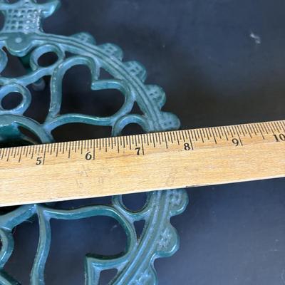 LOT 94: Vintage Family Tree Cast Iron Trivets, Vintage Black Cast Iron Footed T-15 Butterfly Trivet & a Green Enamel Old Dutch Design...