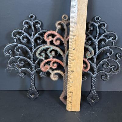 LOT 94: Vintage Family Tree Cast Iron Trivets, Vintage Black Cast Iron Footed T-15 Butterfly Trivet & a Green Enamel Old Dutch Design...