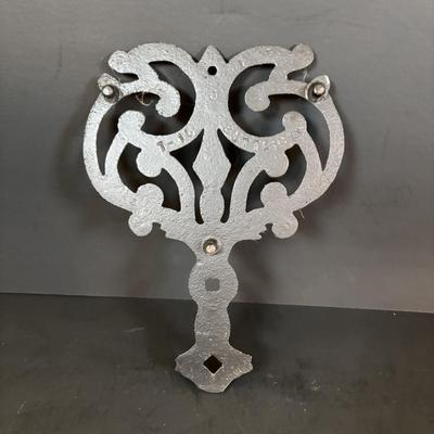 LOT 94: Vintage Family Tree Cast Iron Trivets, Vintage Black Cast Iron Footed T-15 Butterfly Trivet & a Green Enamel Old Dutch Design...