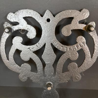 LOT 94: Vintage Family Tree Cast Iron Trivets, Vintage Black Cast Iron Footed T-15 Butterfly Trivet & a Green Enamel Old Dutch Design...