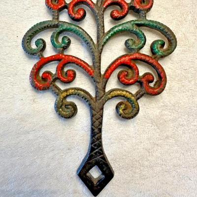 LOT 94: Vintage Family Tree Cast Iron Trivets, Vintage Black Cast Iron Footed T-15 Butterfly Trivet & a Green Enamel Old Dutch Design...