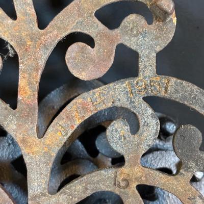 LOT 94: Vintage Family Tree Cast Iron Trivets, Vintage Black Cast Iron Footed T-15 Butterfly Trivet & a Green Enamel Old Dutch Design...