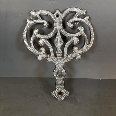 LOT 94: Vintage Family Tree Cast Iron Trivets, Vintage Black Cast Iron Footed T-15 Butterfly Trivet & a Green Enamel Old Dutch Design...