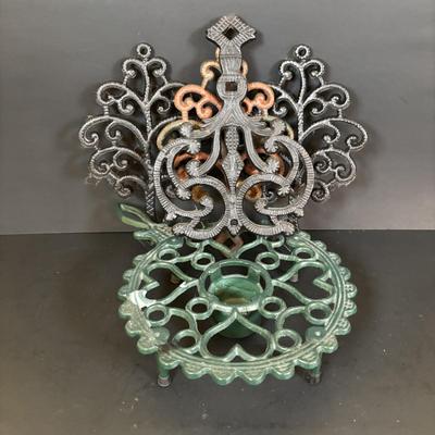 LOT 94: Vintage Family Tree Cast Iron Trivets, Vintage Black Cast Iron Footed T-15 Butterfly Trivet & a Green Enamel Old Dutch Design...