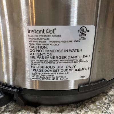 LOT 105: Instant Pot Pressure Cooker