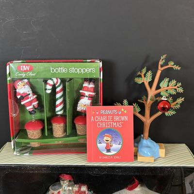 LOT 112: Holiday Collectibles: Miniature Peanuts Book & Charlie Brown Tree, NECA Snow Miser Bobble Head, Disney Ornaments, Gourd...