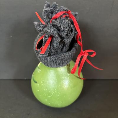 LOT 112: Holiday Collectibles: Miniature Peanuts Book & Charlie Brown Tree, NECA Snow Miser Bobble Head, Disney Ornaments, Gourd...