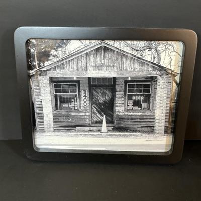 LOT 114: Black & White Framed Photos of Store Fronts, Ande Rooney Metal Sign, Coca-Cola Glasses, 1993 Coca-Cola Vending Machine...